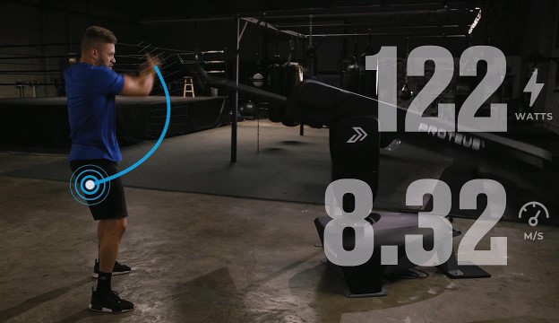 A man performing a dynamic strength test using the Proteus Motion training system.